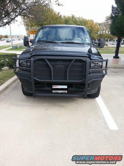 Black 2000 Ford Excursion with a large black grille guard parked in a lot