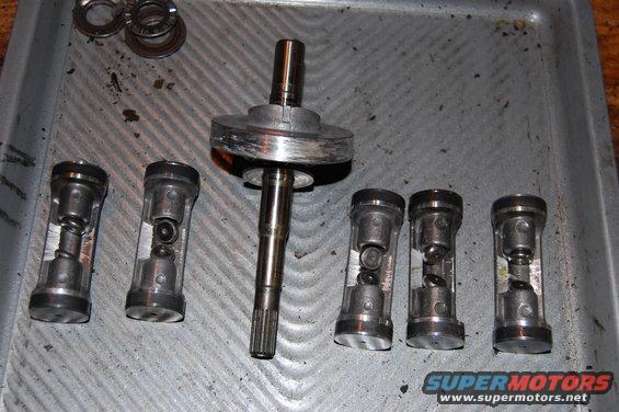 Swash plate and pistons. Note the extensive damage to the swash plate and all pistons.