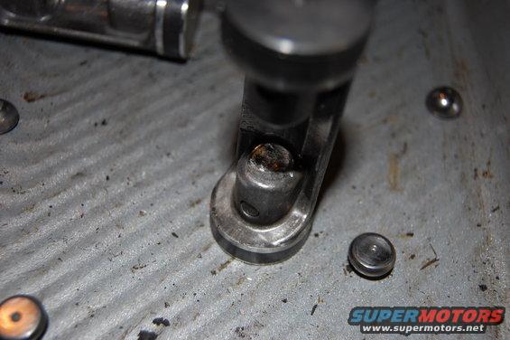 The pocket that the pad rides in on this piston is also damaged.