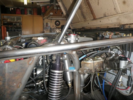 Engine bay with roll cage and brake master cylinder