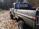 1970 Ford F-250 - This 1970 Ford F-250 pickup truck features a roll bar and various stickers on its rear window.