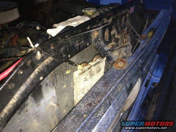 1970 Ford F-250 engine bay with radiator and grille. Blue paint visible