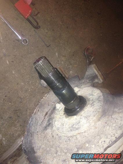 Splined shaft extending from a differential housing with tools nearby