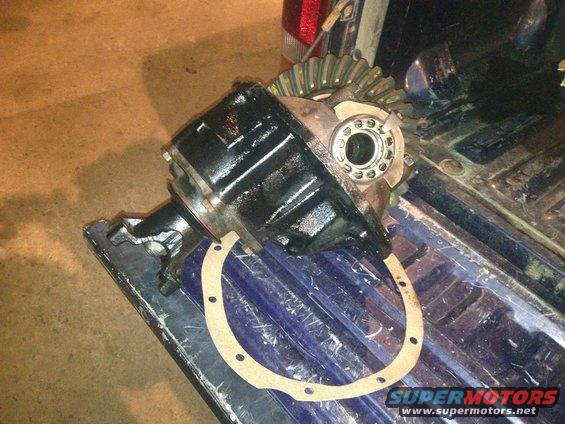 differential assembly and gasket sitting in the bed of a pickup truck