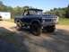 1970 Ford F-250 - This lifted 1978 Ford Bronco features a distinctive grille and dual-tone paint scheme.