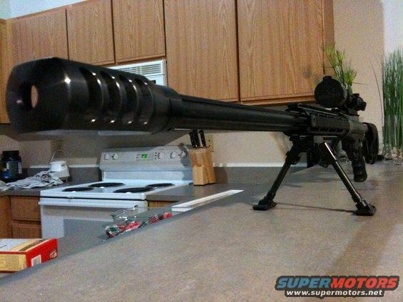 Sniper rifle with bipod and scope on a kitchen counter