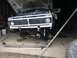 1970 Ford F-250 - Front view of a 1970 Ford F-250 truck with its hood up and bumper detached for service.