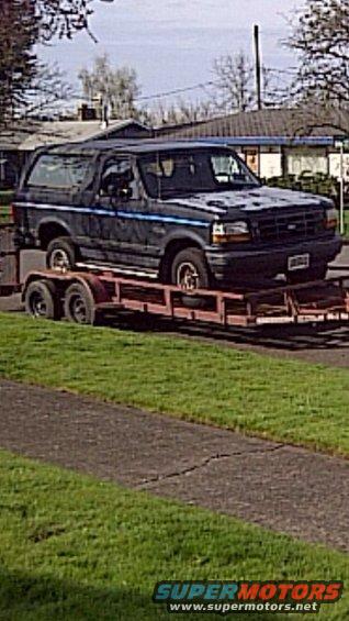 Dark blue 1992 Ford Bronco on a trailer, 3/4 front view