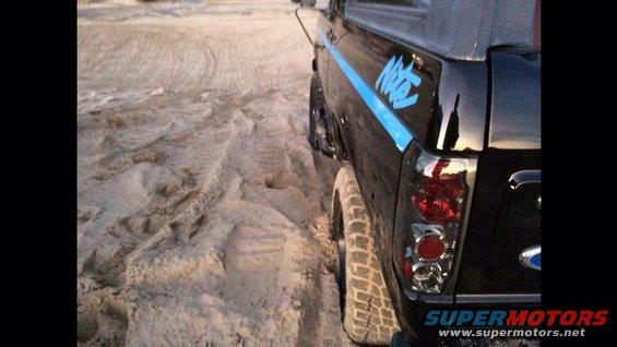 1992 Ford Bronco Nite edition rear side view in sand