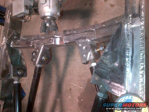 custom suspension parts, possibly for a Jeep build, with visible welding and metal fabrication