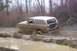 1978 Ford Bronco - Ford Bronco tackles a challenging muddy off-road course.