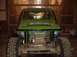 1992 Ford Bronco - This green off-road vehicle has a roll cage and a winch mounted on the front.