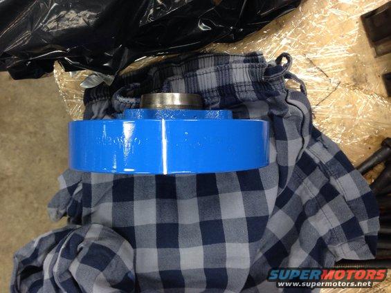Blue painted engine pulley with visible text