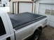 2000 Ford F-250 - Rear view of a 2000 Ford F-250 pickup truck a tonneau cover over the bed.