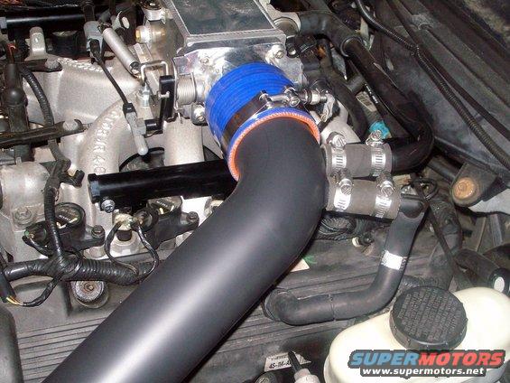 Engine intake tube with blue and orange silicone coupler