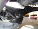 1992 Ford Bronco - Detail of a vehicle's suspension system, focusing on the linkage and tire.