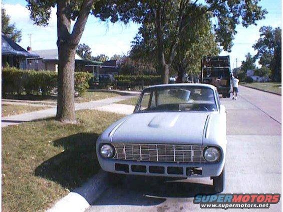 Gray 1960 Ford Falcon parked on a residential street, front view