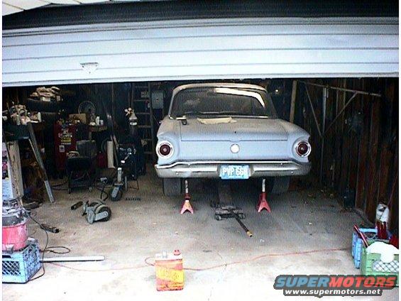 Rear view of a 1960 Ford Falcon on jack stands