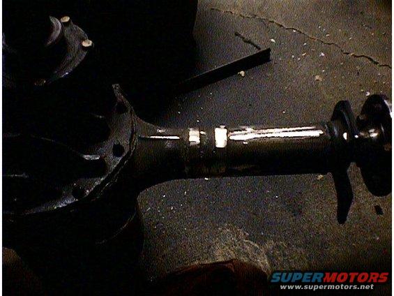 close-up of a rear axle assembly with a driveshaft connected