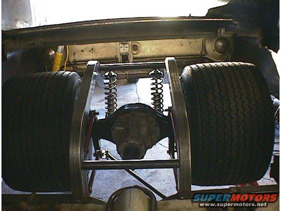 Rear axle assembly with large tires and coilover suspension, likely a custom build