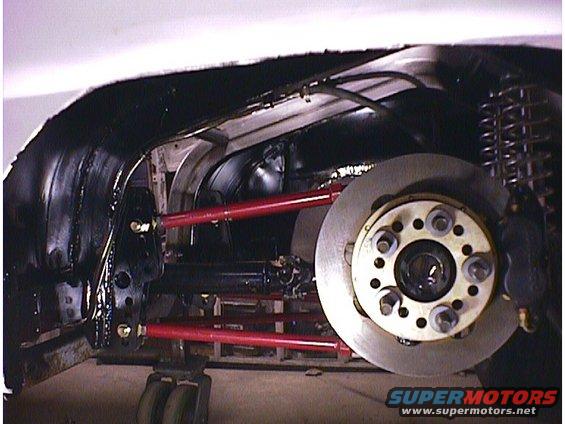 Rear suspension with red control arms and disc brake assembly