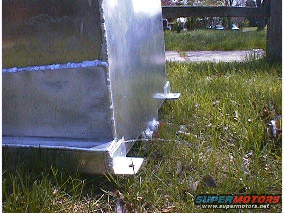 Aluminum fuel tank with visible welds and mounting brackets