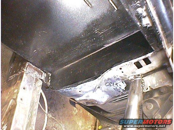Underbody of a car with visible welding and structural components