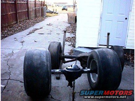 Rear axle assembly with oversized drag racing tires