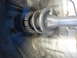 2003 Ford Taurus - This image shows a vehicle's suspension strut and spring, a component crucial for ride comfort and handling.