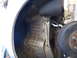 2003 Ford Taurus - Undercarriage view of a vehicle's wheel well and suspension system, including brake components.