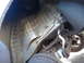 2003 Ford Taurus - Close-up view of the undercarriage, focusing on the rear suspension and wheel well area.