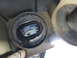 2003 Ford Taurus - Worn strut mount bushing showing deterioration of rubber and metal parts.