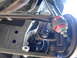 2003 Ford Taurus - Underside view of a vehicle's suspension system, focusing on a ball joint assembly.