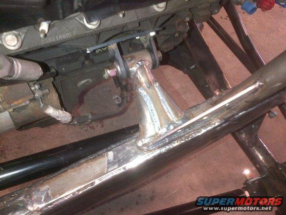 Close-up of custom tube chassis with engine mount and part of an engine block