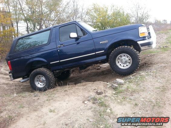 Blue 1995 Ford Bronco on dirt trail