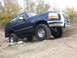 1995 Ford Bronco - This 1995 Ford Bronco is shown navigating a rough, unpaved terrain.