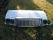 1994 Jeep Cherokee - Front end parts for a 1994 Jeep Cherokee are laid out on the grass.