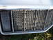 1994 Jeep Cherokee - Close-up of the front grille and headlight assembly on a 1994 Jeep Cherokee.
