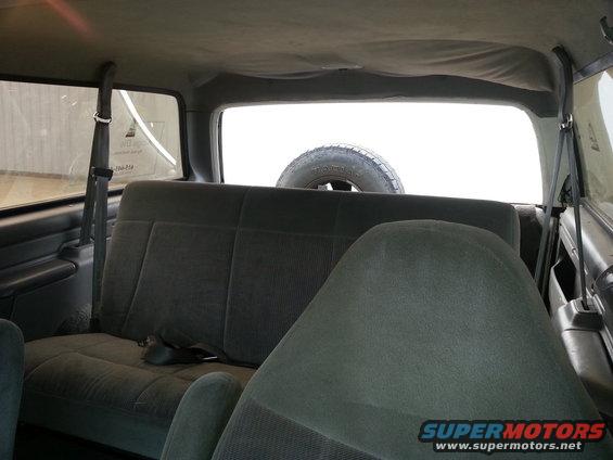 Interior rear seats and spare tire mounted in 1996 Ford Bronco