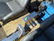 1992 Ford Bronco - Interior view of a vehicle showing seats, a shifter, and a blue engine block.