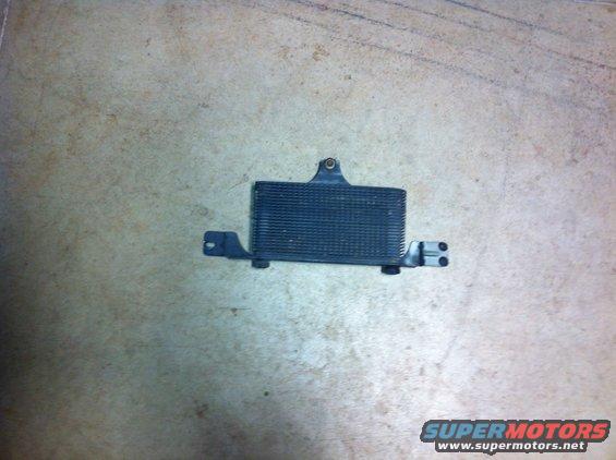 black metal oil cooler with mounting brackets