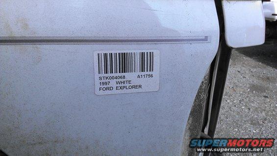 White Ford Explorer door with barcode sticker showing year 1997