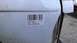 1990 Ford Bronco - A barcode sticker on a white vehicle door indicates it is a 1997 Ford Explorer, contradicting the registry's claim of a 1990 Ford Bronco.