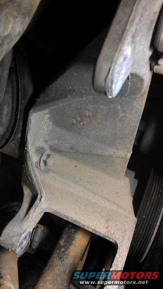Engine bracket with handwritten '1990' marking
