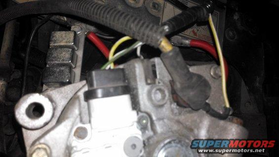 Close-up of alternator wiring with red and yellow cables