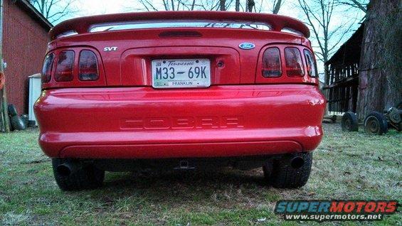 Red Ford Mustang Cobra rear view, SVT badge, Tennessee license plate M33-69K