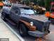 1972 Ford Ranchero - This heavily modified pickup truck features a distinctive front-end design and appears to be on a construction site.