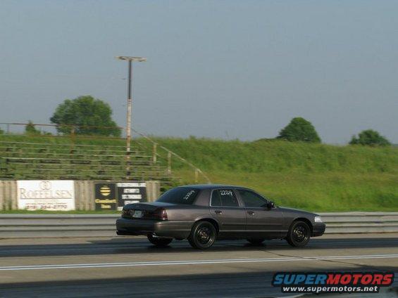 Gray 2004 Ford Crown Victoria on a drag strip, number 2724 on the rear window