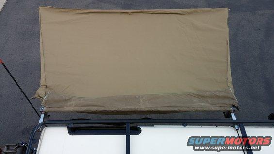 tan car awning extended over roof rack