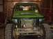 1992 Ford Bronco - Front view of a green off-road vehicle with a winch and prominent SUZUKI branding on the grille.